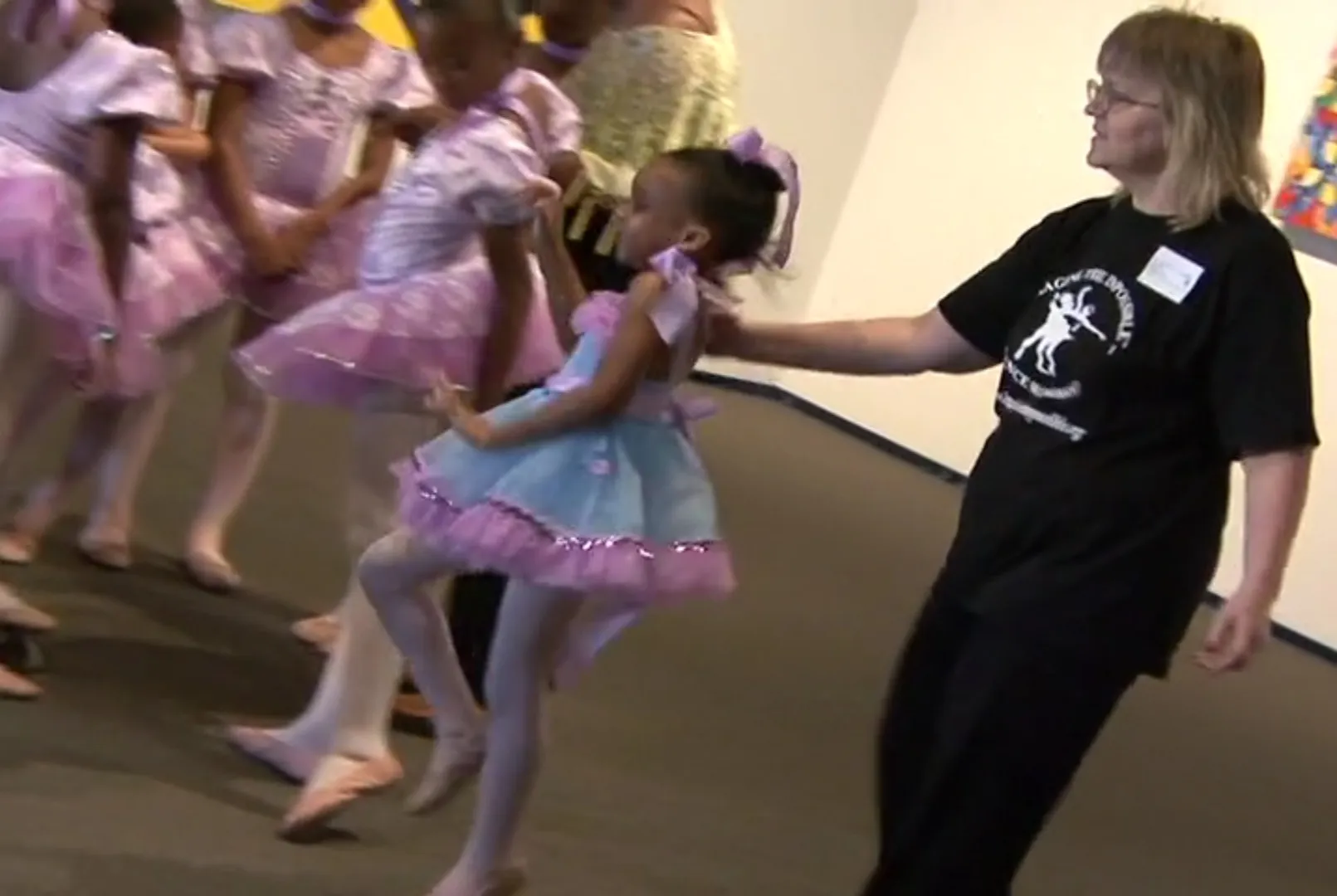 A young IMAGINE... dancer rehearsing with her class